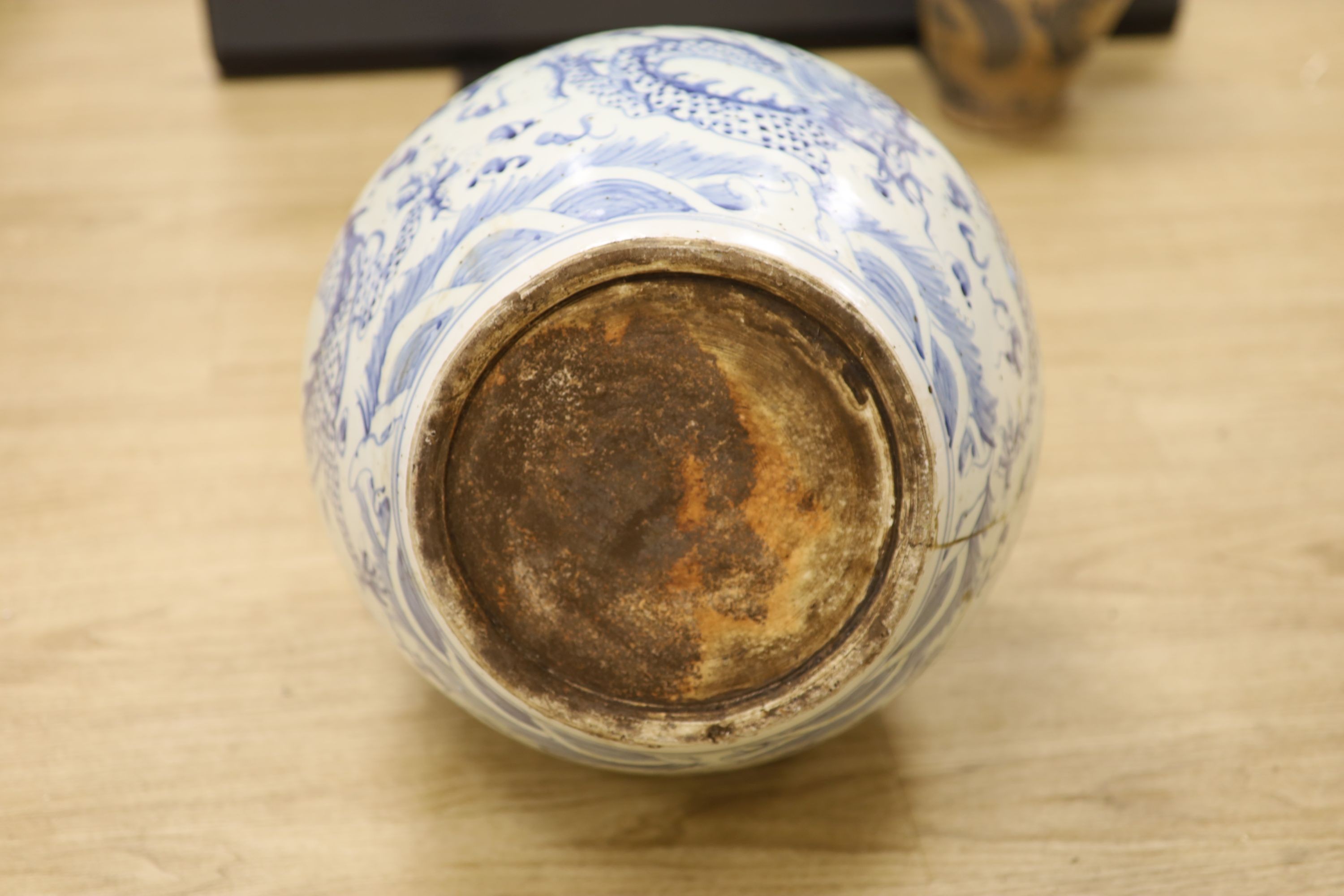 A large Chinese blue and white ‘dragon’ double gourd vase, 64cm high and an Annamese style blue and white crackle glaze jar